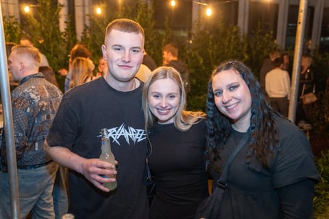Three young people posing together